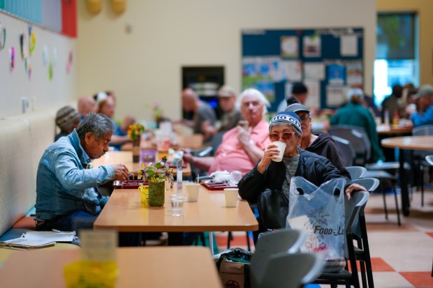 Lunch guests in the dining room at the Serving Senior Center enjoy the music performed by John Conroy, 68, on the piano on Tuesday, March 17, 2026, in San Diego, CA. (Nelvin C. Cepeda / The San Diego Union-Tribune)