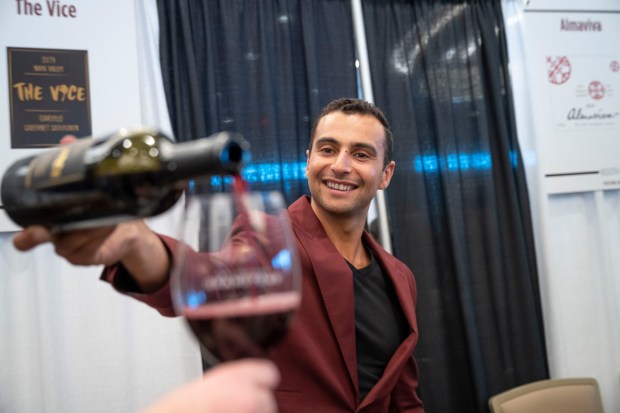 A representative from The Vice Wine pours a sample at Wine Spectator's Grand Tour tasting event, which takes place April 25 in Chula Vista. (Jacob Kepler)
