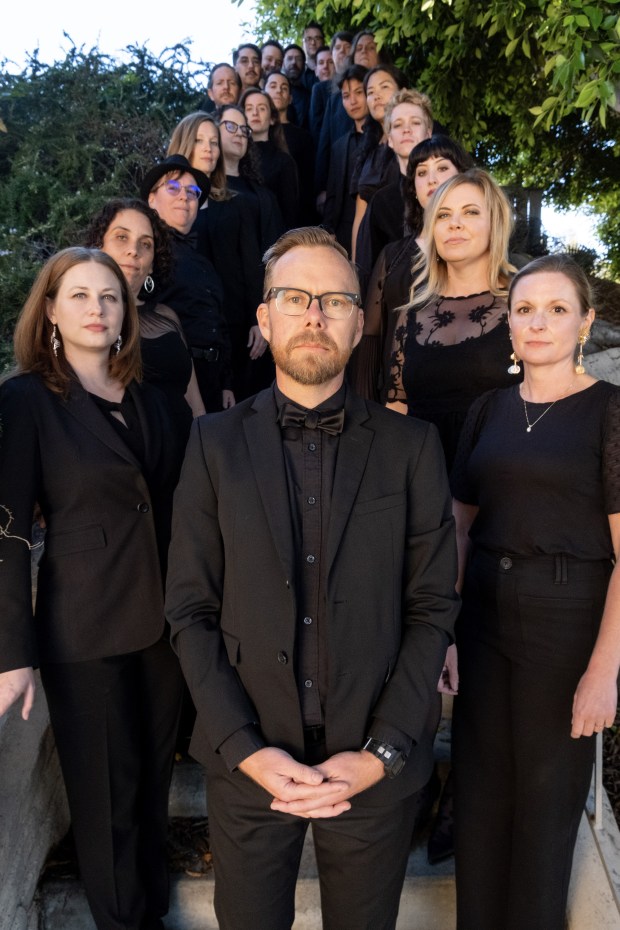 Sacra/Profana artistic director Juan Carlos Acosta with members of the San Diego professional choral ensemble. (Esteban Marin)
