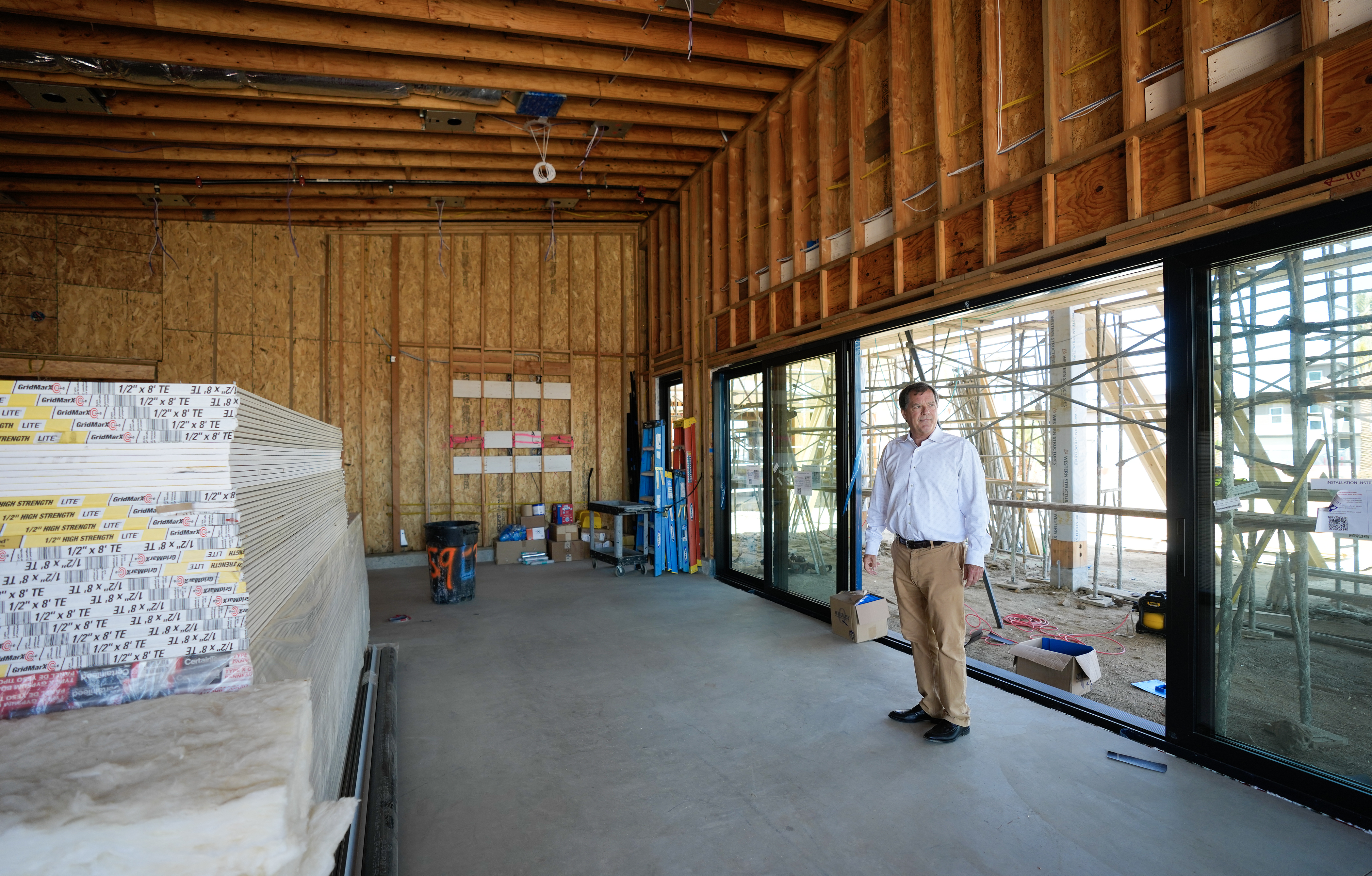 Paul Barnes, a division president of Shea Homes, walks through...