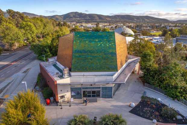 April 10, 2026_San Marcos, CA_Exterior view of the Palomar College Planetarium with its main entrance below  in this view looking south. In the distance is the school's landmark dome that houses the school's gymnasium. (Charlie Neuman / For The San Diego Union-Tribune)