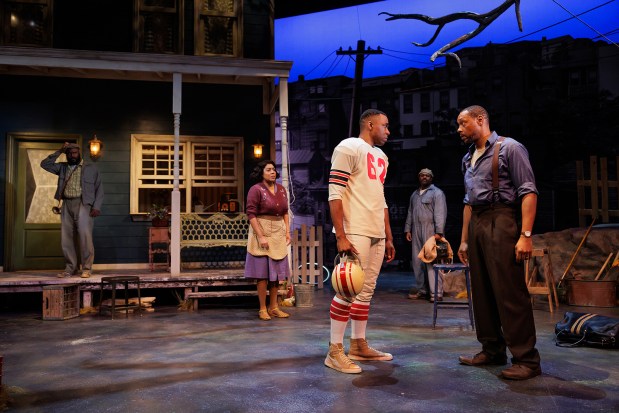 Donathan Walters as Gabriel, left, De'Adre Aziza as Rose, Omari K. Chancellor as Cory, Rondrell McCormick as Jim Bono, and Dorian Missick as Troy in August Wilson's "Fences" at The Old Globe. (Rich Soublet II)