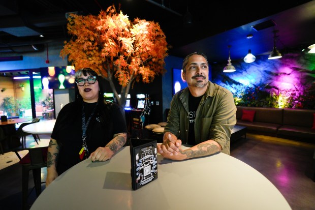National City, CA - April 16: On Thursday, Alex Ayon, co-owner, and Mayra Estrada, general manager of Session by the Bay in National City, observe as the lounge section of the club opens to their customers. (Nelvin C. Cepeda / The San Diego Union-Tribune)