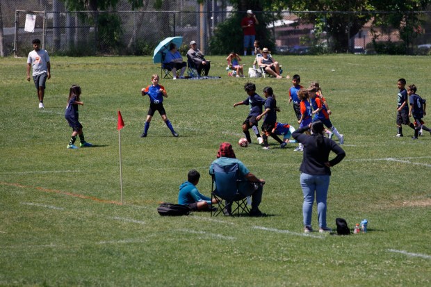 Children play soccer on the field at Colina del Sol Park on Saturday, April 18, 2026. (Kristian Carreon / The San Diego Union-Tribune)