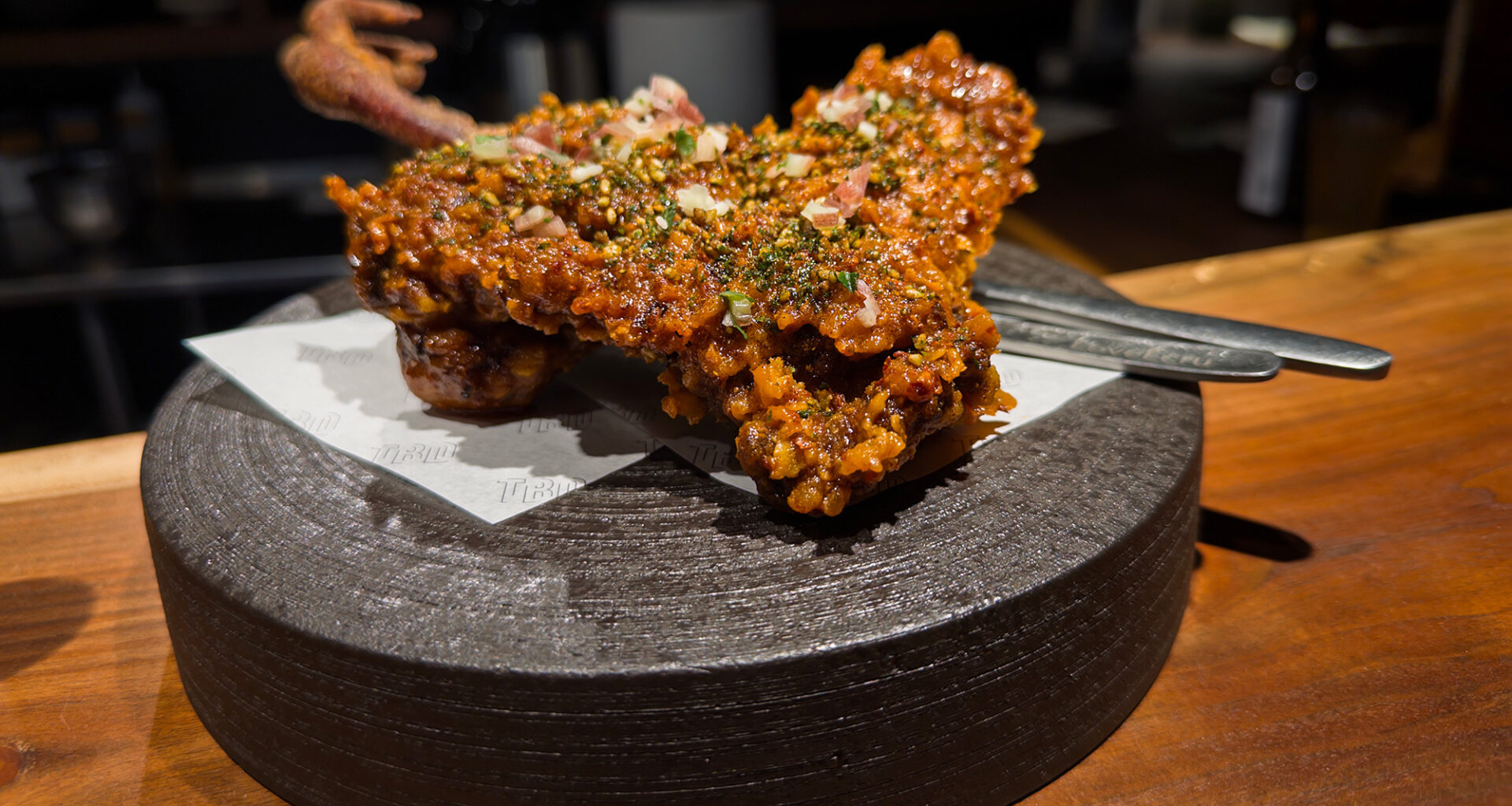 Japanese-style fried chicken leg, served with the claw still attached.