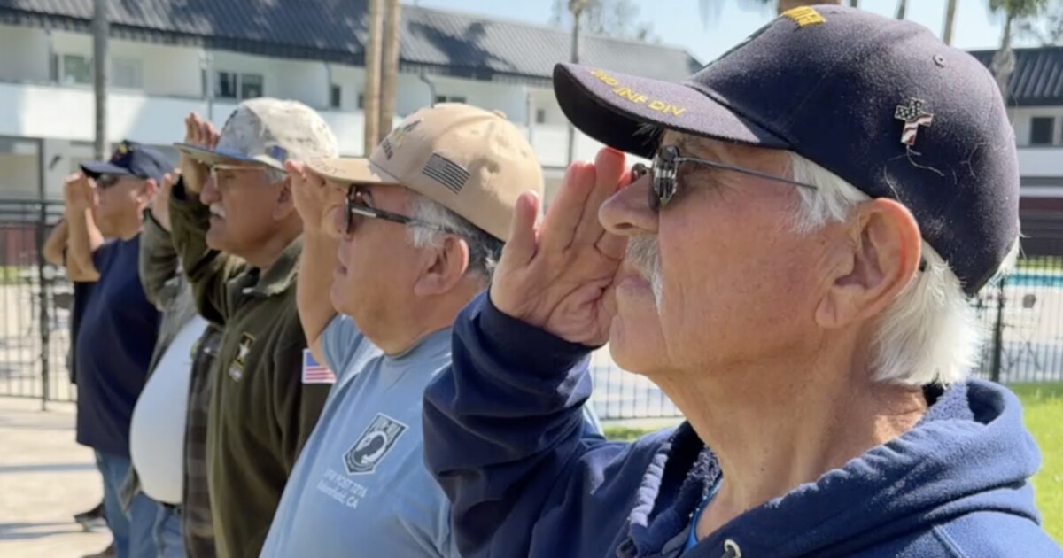 Bakersfield veterans raise flag at assisted living facility