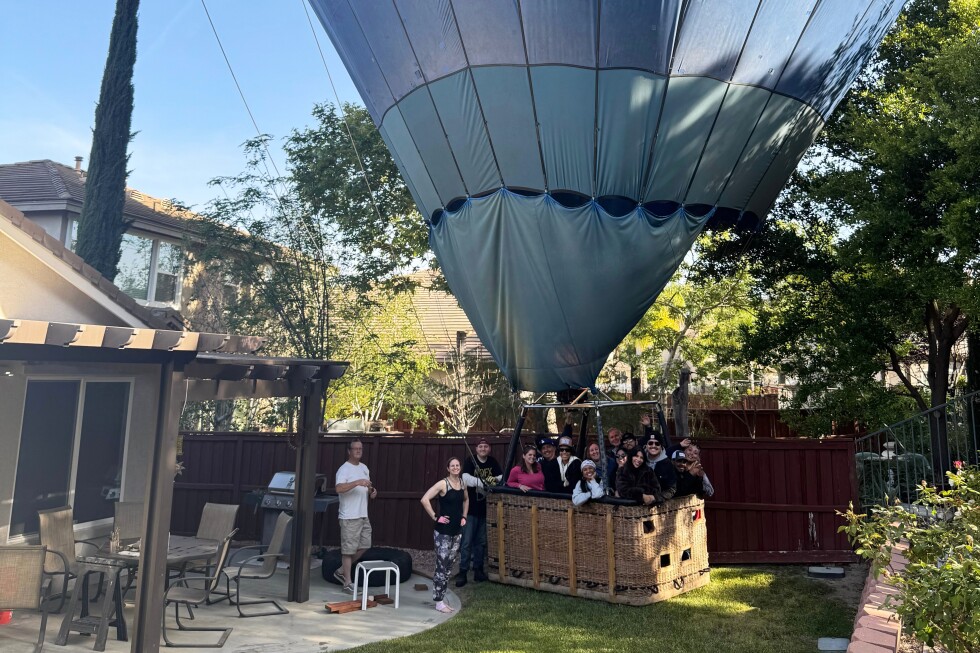 Hot air balloon with 13 people safely lands in California yard