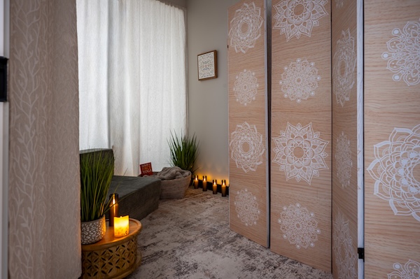 A tranquil wellness room inside The Wagner Law Group's new 3,680 square-foot office features mandala-patterned room dividers, candlelight and soft furnishings — a serene contrast to the firm's legal work. Photo courtsey of Wagner Law Group
