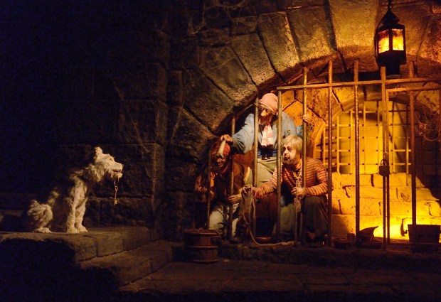 Three skeleton pirates try to coax a key from a skeleton dog during Pirates of the Caribbean on June 22, 2016. (File photo by Jeff Gritchen, Orange County Register/SCNG) 
