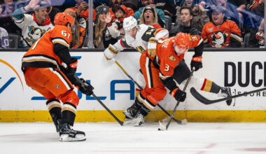 May 10, 2026; Anaheim, California, USA; Anaheim Ducks defenseman Ian Moore (3) and Vegas Golden Knights defenseman Ben Hutton (17) contend for the puck during the third period in game four of the second round of the 2026 Stanley Cup Playoffs at Honda Center. Mandatory Credit: Corinne Votaw-Imagn Images
