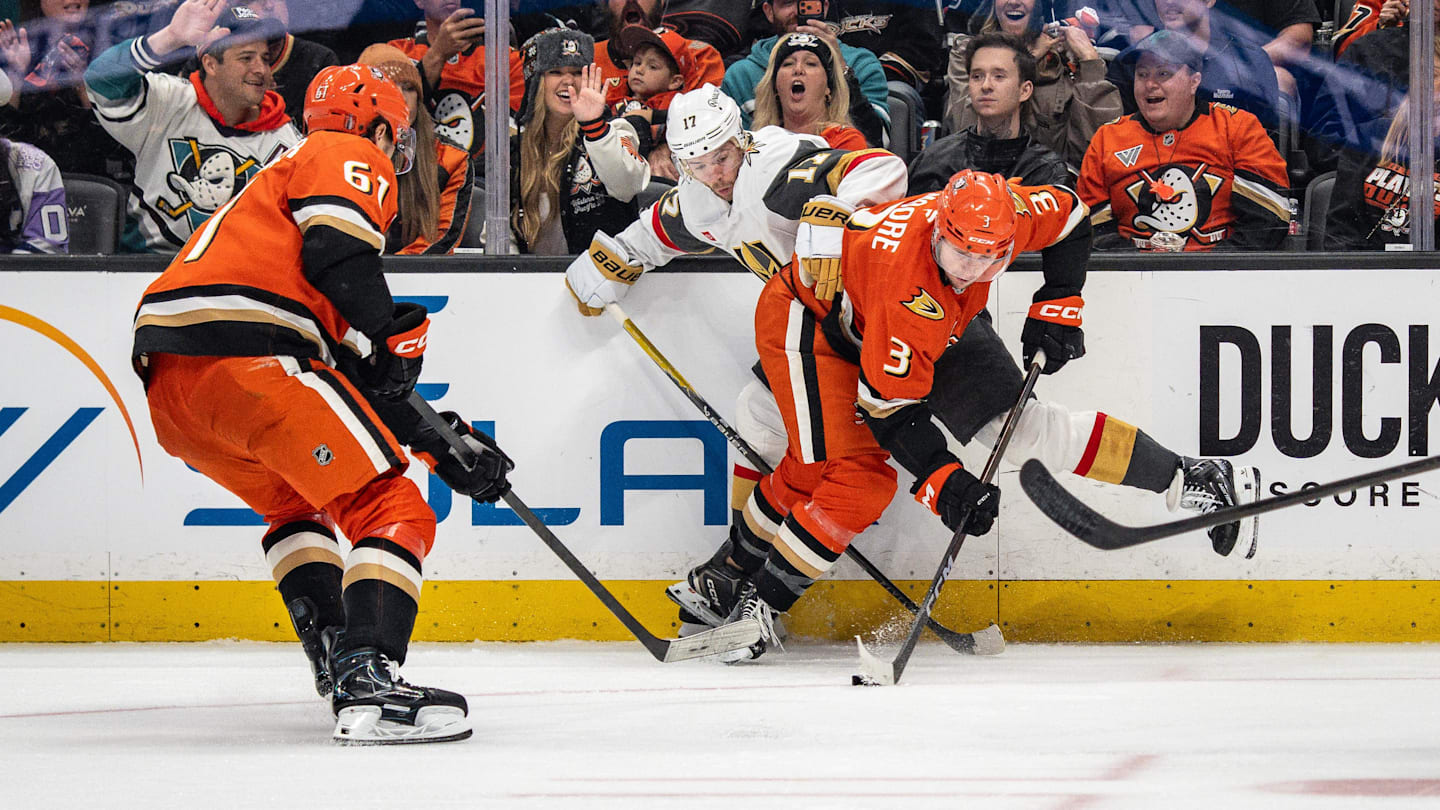 May 10, 2026; Anaheim, California, USA; Anaheim Ducks defenseman Ian Moore (3) and Vegas Golden Knights defenseman Ben Hutton (17) contend for the puck during the third period in game four of the second round of the 2026 Stanley Cup Playoffs at Honda Center. Mandatory Credit: Corinne Votaw-Imagn Images