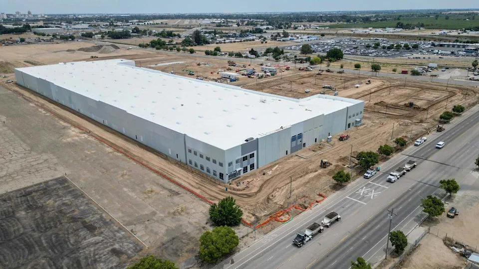 A giant warehouse is shown under construction on the northeast corner of Marks and Nielsen in west Fresno. The project, which was proposed more than five years ago, will result in three warehouse buildings totaling more than 800,000 square feet.