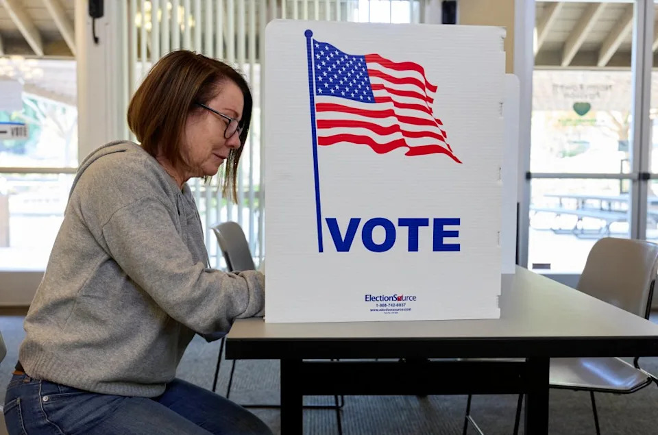 A voter fills out a ballot at an El Dorado County. REUTERS