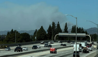 Fast-growing brush fire in Southern California threatens homes