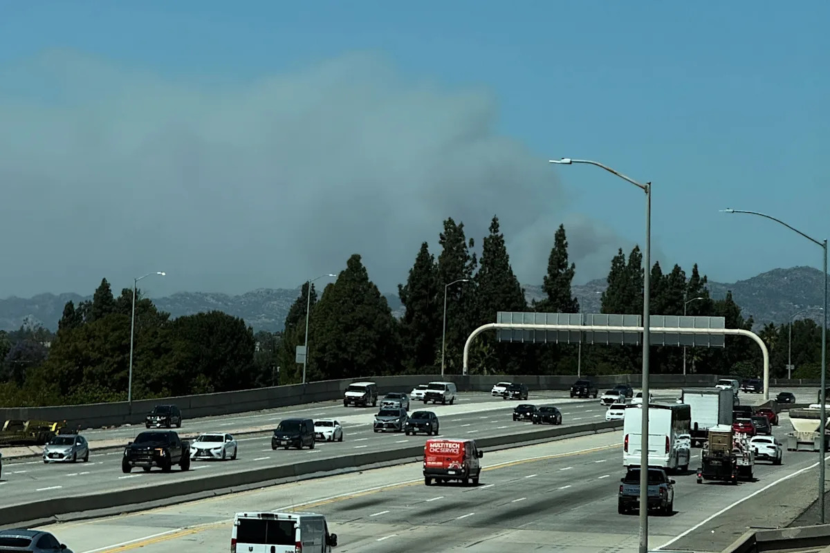 Fast-growing brush fire in Southern California threatens homes
