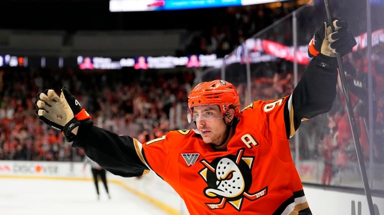 Anaheim Ducks center Leo Carlsson celebrates his empty net goal...
