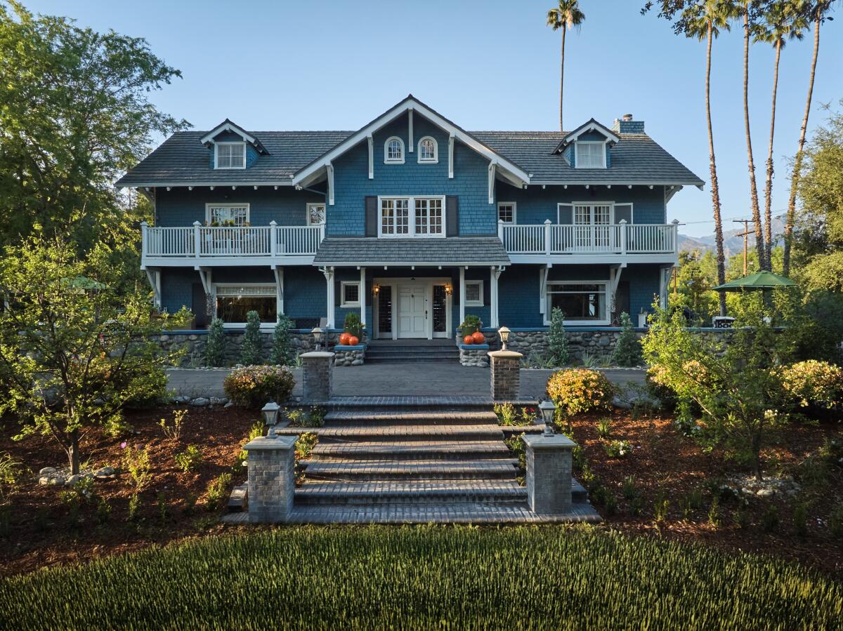 A blue shingled mansion 