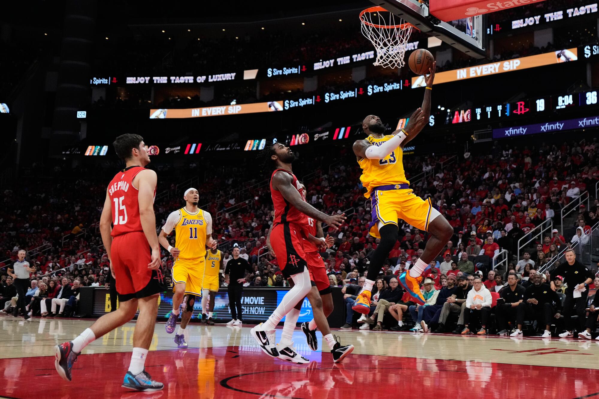 Lakers forward LeBron James scores on an uncontested layup after blowing past the Rockets defense during Game 6.