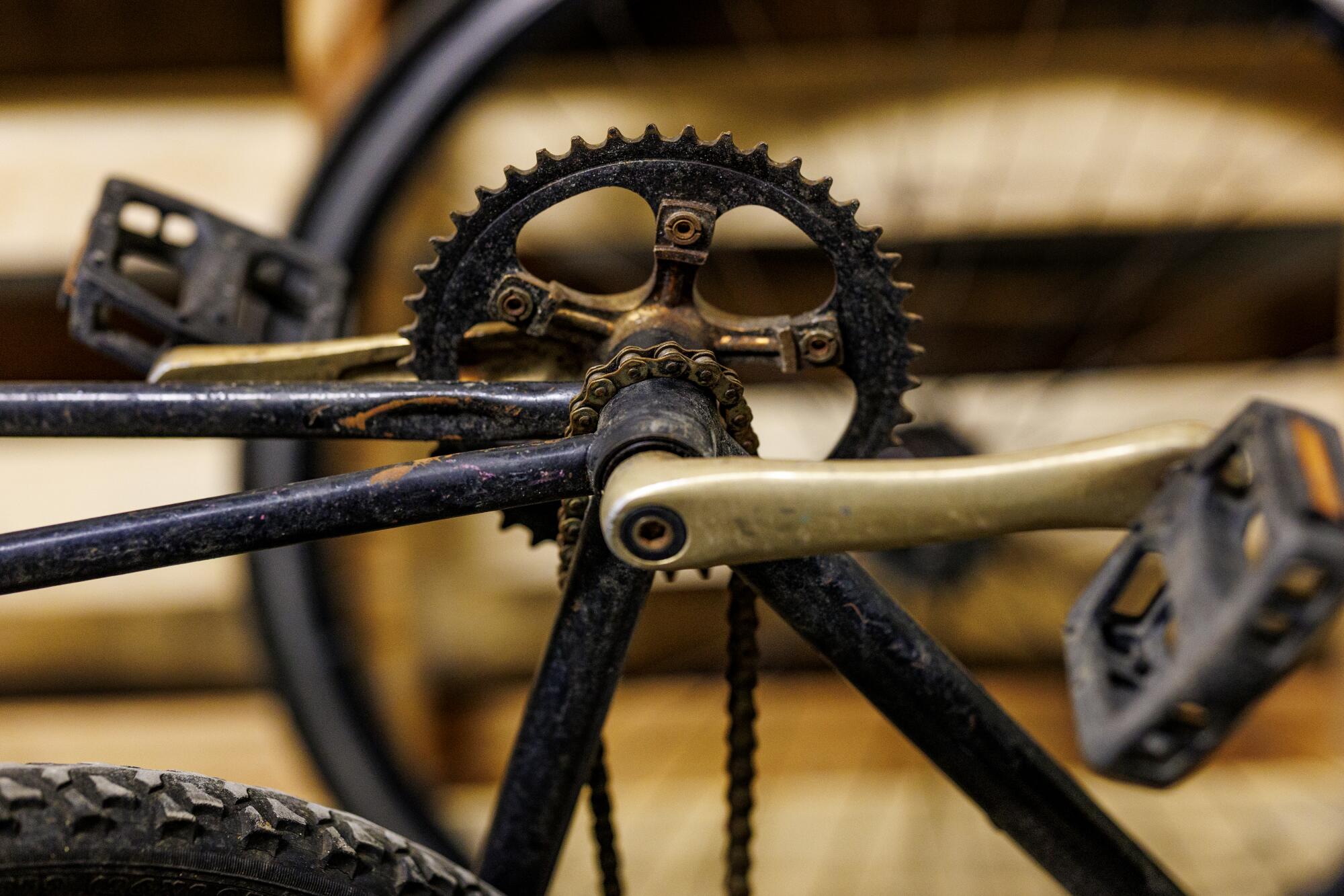 A rusty chain and sprocket on one of the hundreds of abandoned bikes in the basement of the shuttered General Hospital.