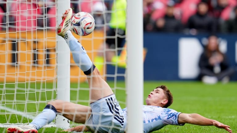 San Jose Earthquakes defender Reid Roberts (18) slides in to...