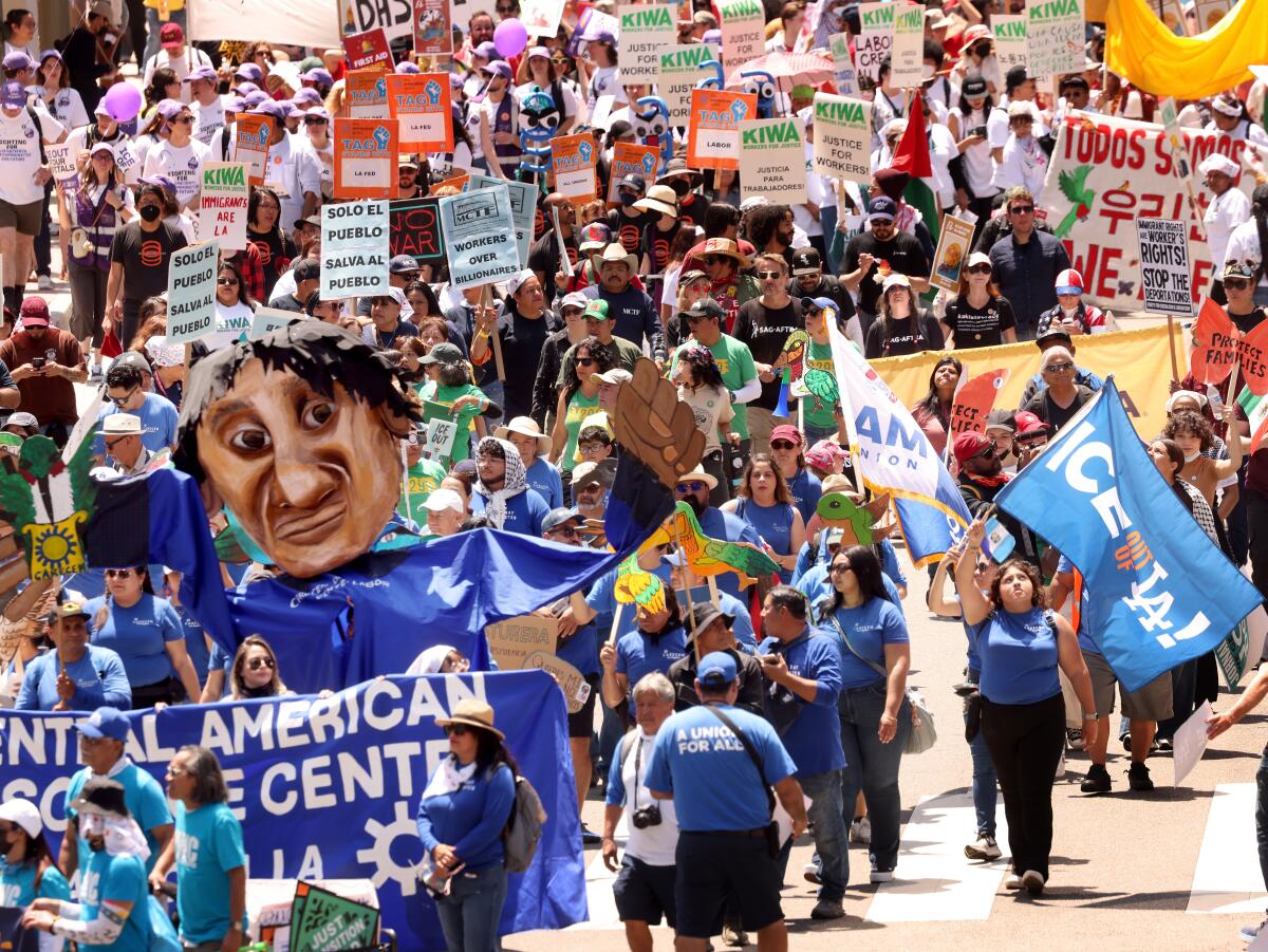 thousands of workers and activists march toward downtown Los Angeles.