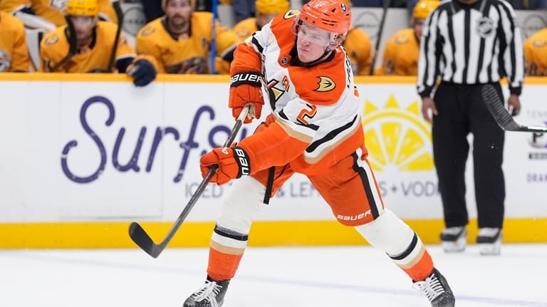 Anaheim Ducks defenseman Jackson LaCombe (2) shoots the puck to...