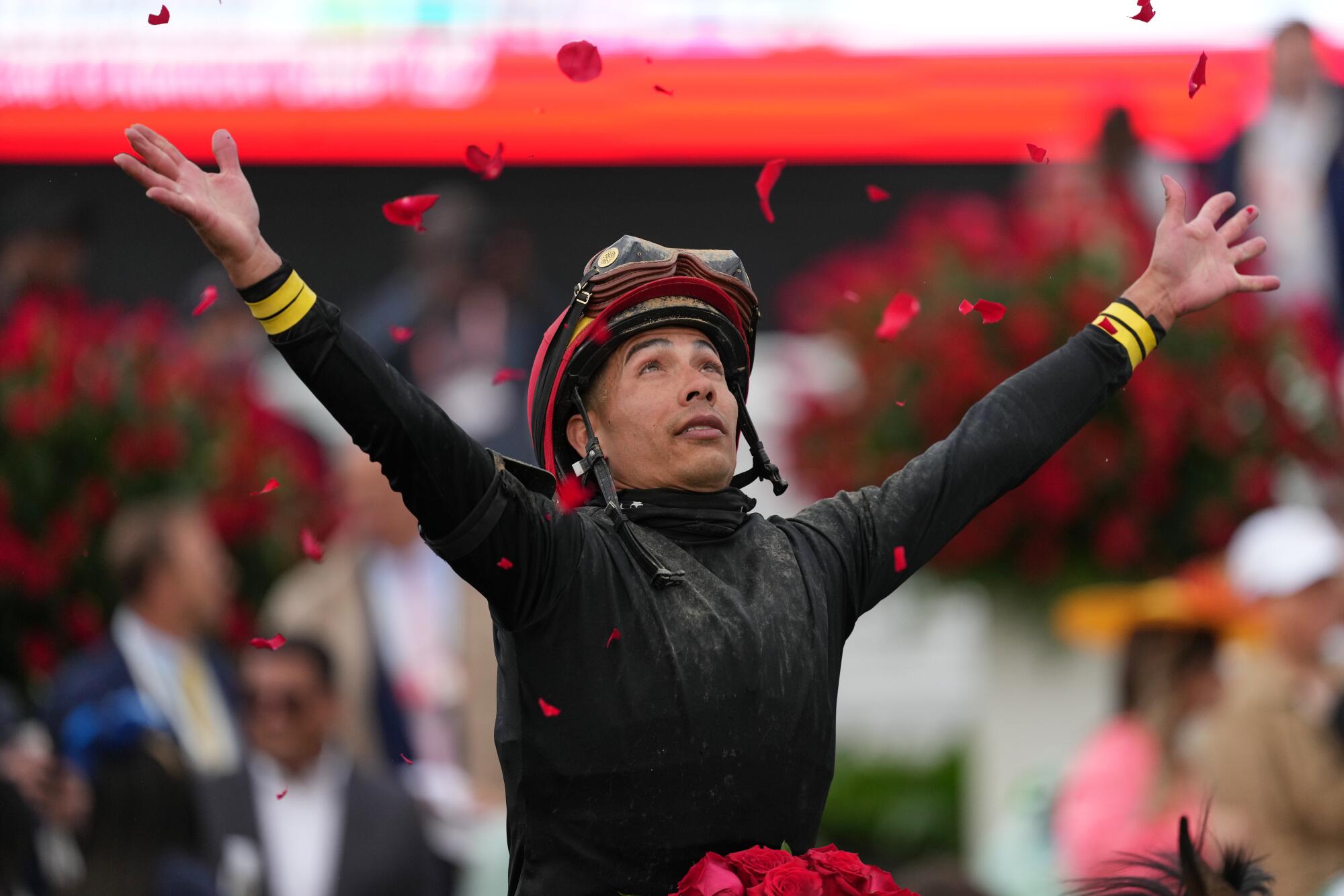 Jockey Jose Ortiz celebrates after riding Golden Tempo to a Kentucky Derby win at Churchill Downs Saturday.