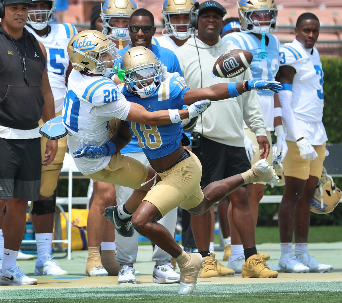 UCLA defensive back Osiris Gilbert knocks the ball out of the hand of UCLA receiver Shane Rosenthal.