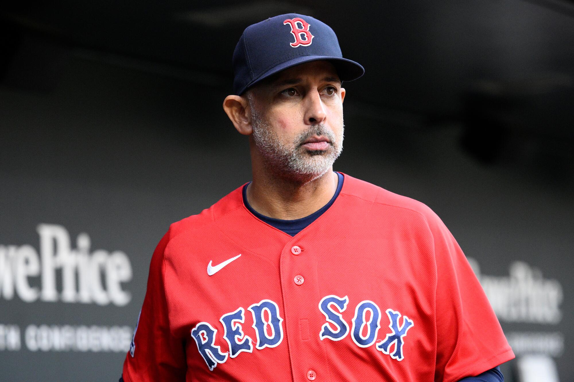 Alex Cora in a Red Sox uniform and cap