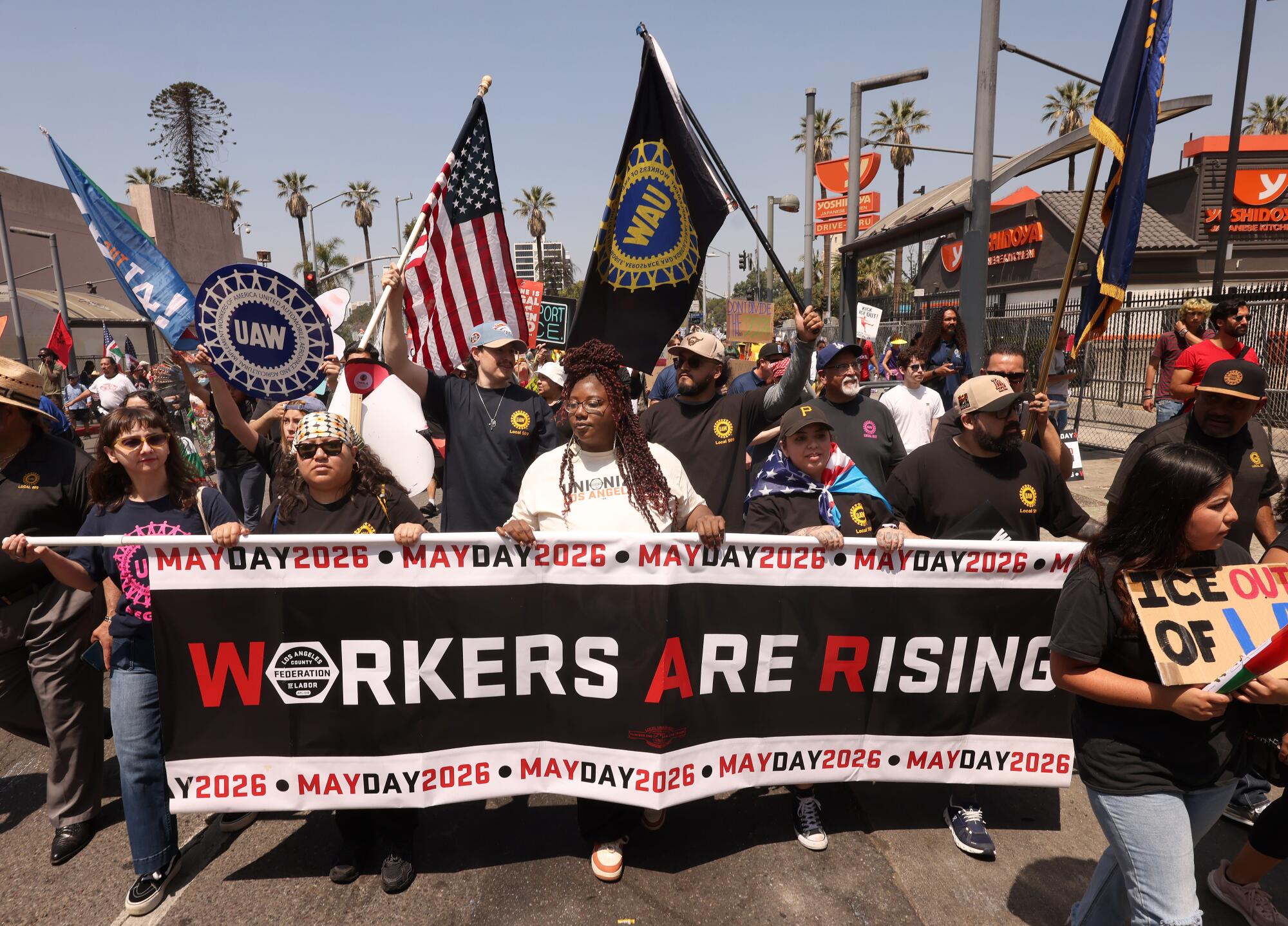 Workers and activists begin their march from MacArthur Park to downtown Los Angeles on Friday in recognition of May Day. 