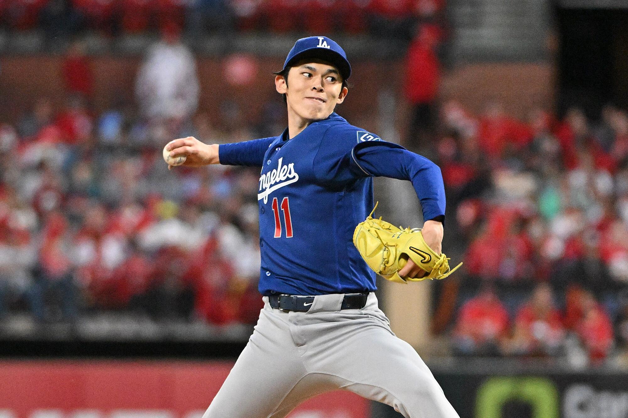 Dodgers pitcher Roki Sasaki throws from the mound during the sixth inning of his team's loss to the Cardinals.