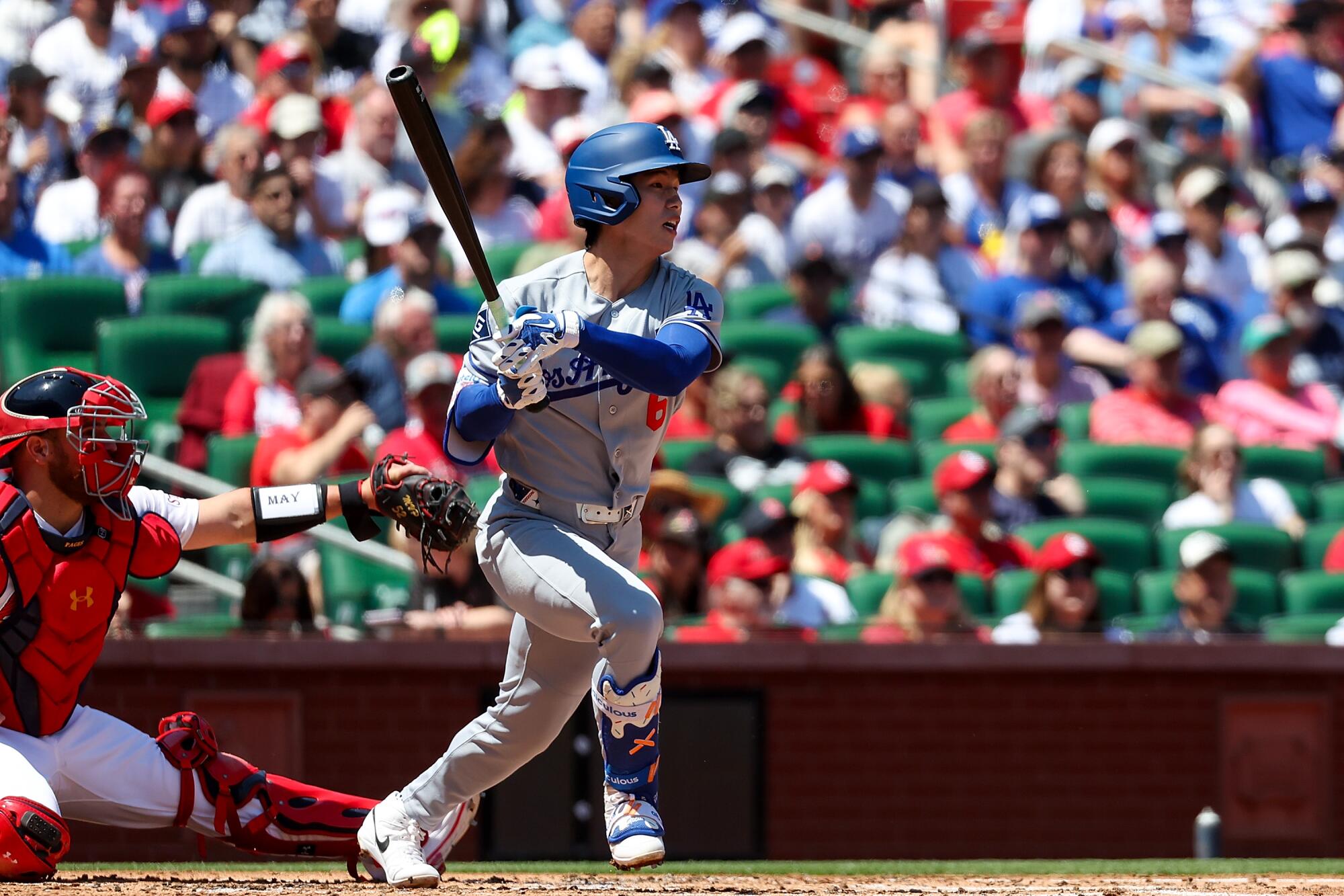 Hyeseong Kim follows through for an RBI single in the second inning for the Dodgers.