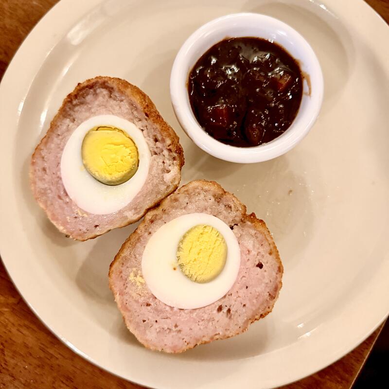 A Scotch egg with a side of Branston Pickle.