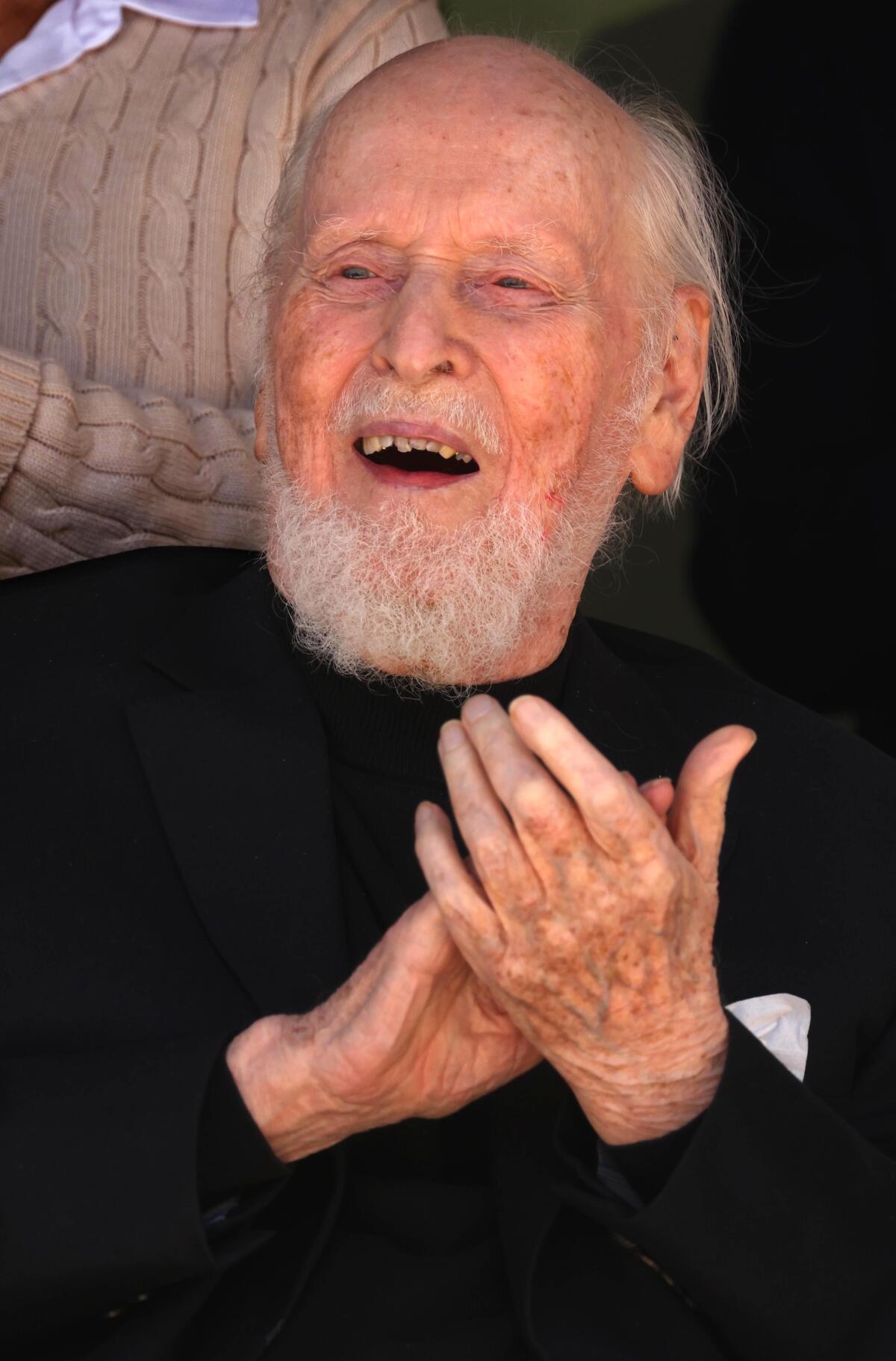 A man claps.