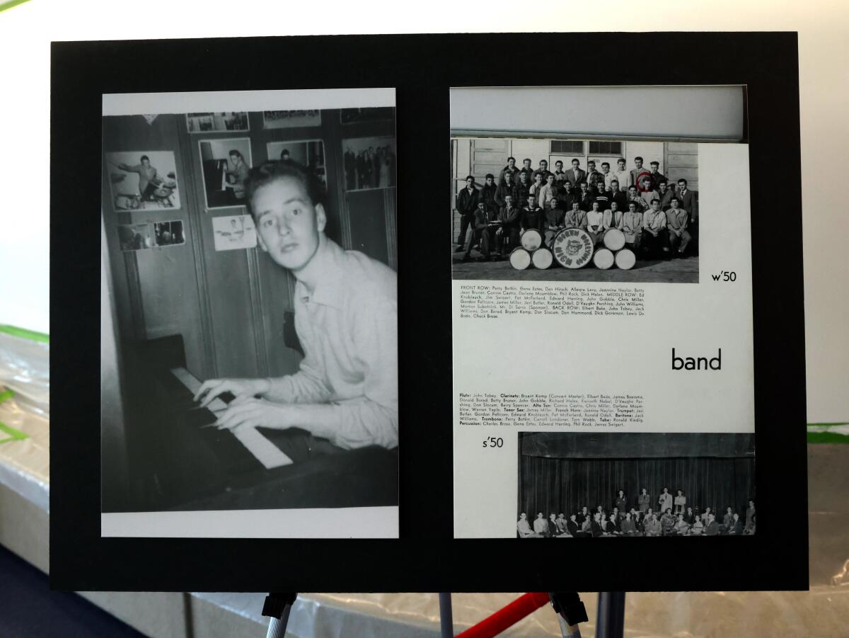 A poster board featuring a young John Williams.
