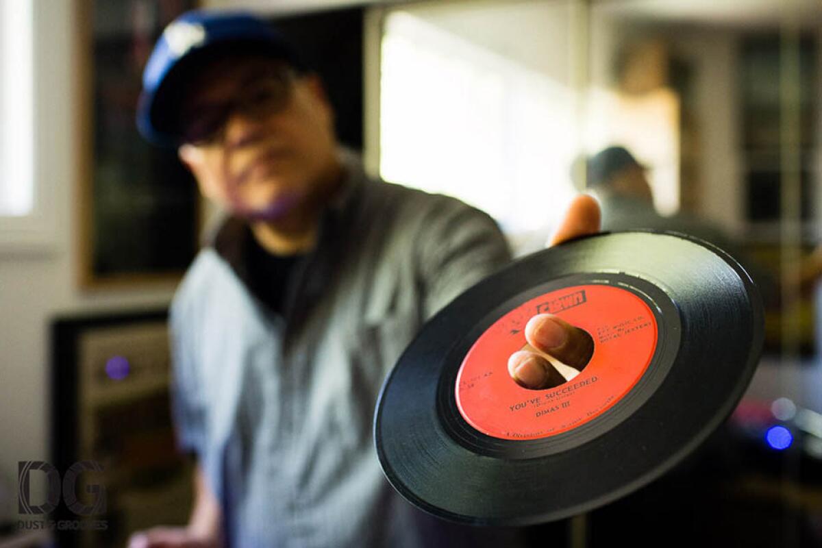 Ruben Molina holding up a 45
