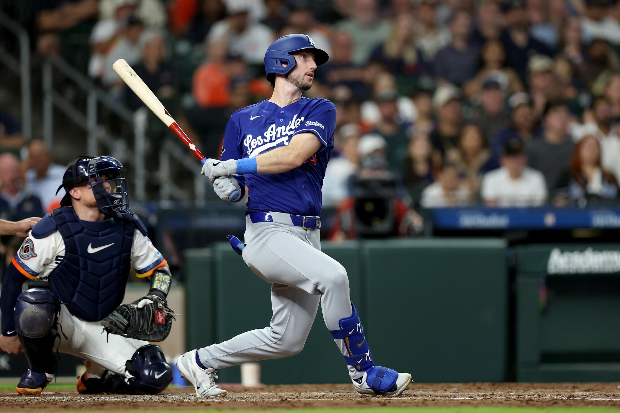 Kyle Tucker hits a solo home run for the Dodgers in the third inning against the Astros on Monday.
