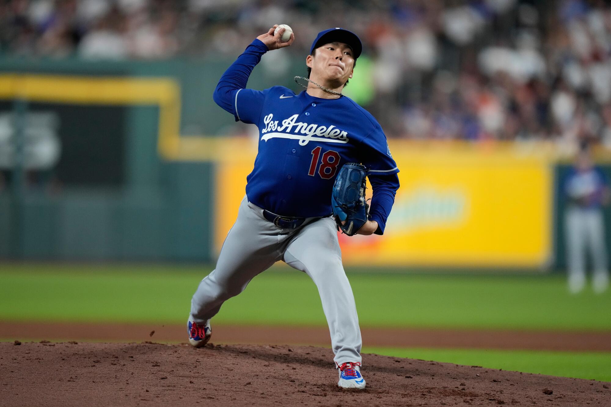 Dodgers starting pitcher Yoshinobu Yamamoto delivers during the first inning Monday against the Astros.