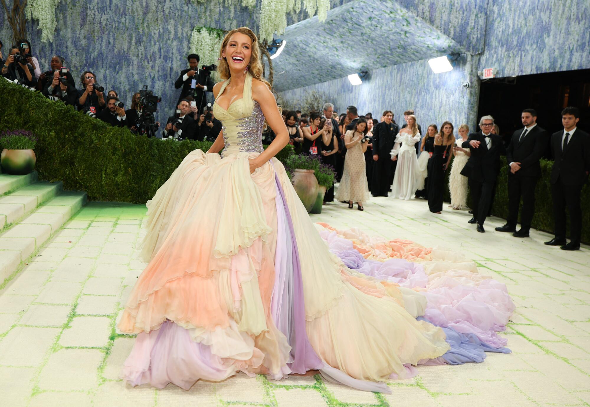 Blake Lively holds up her ballgown at the Met Gala. 