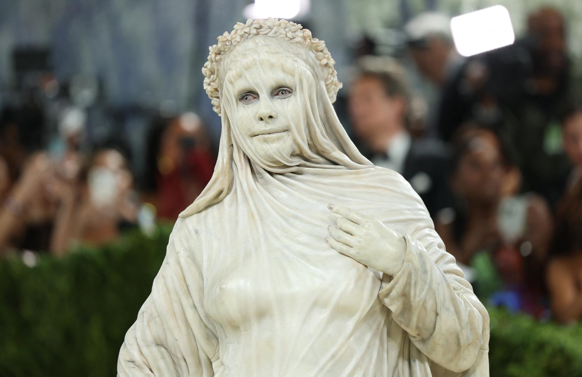 Heidi Klum looks like a marble statue. 