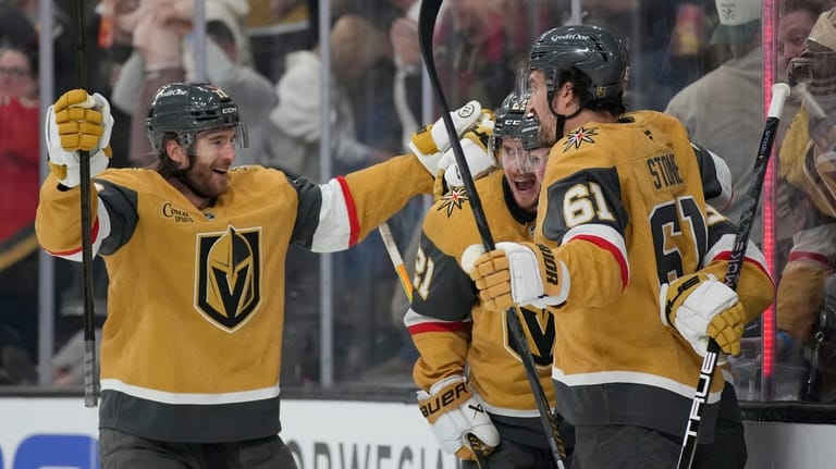 Vegas Golden Knights center Brett Howden, second from left, celebrates...