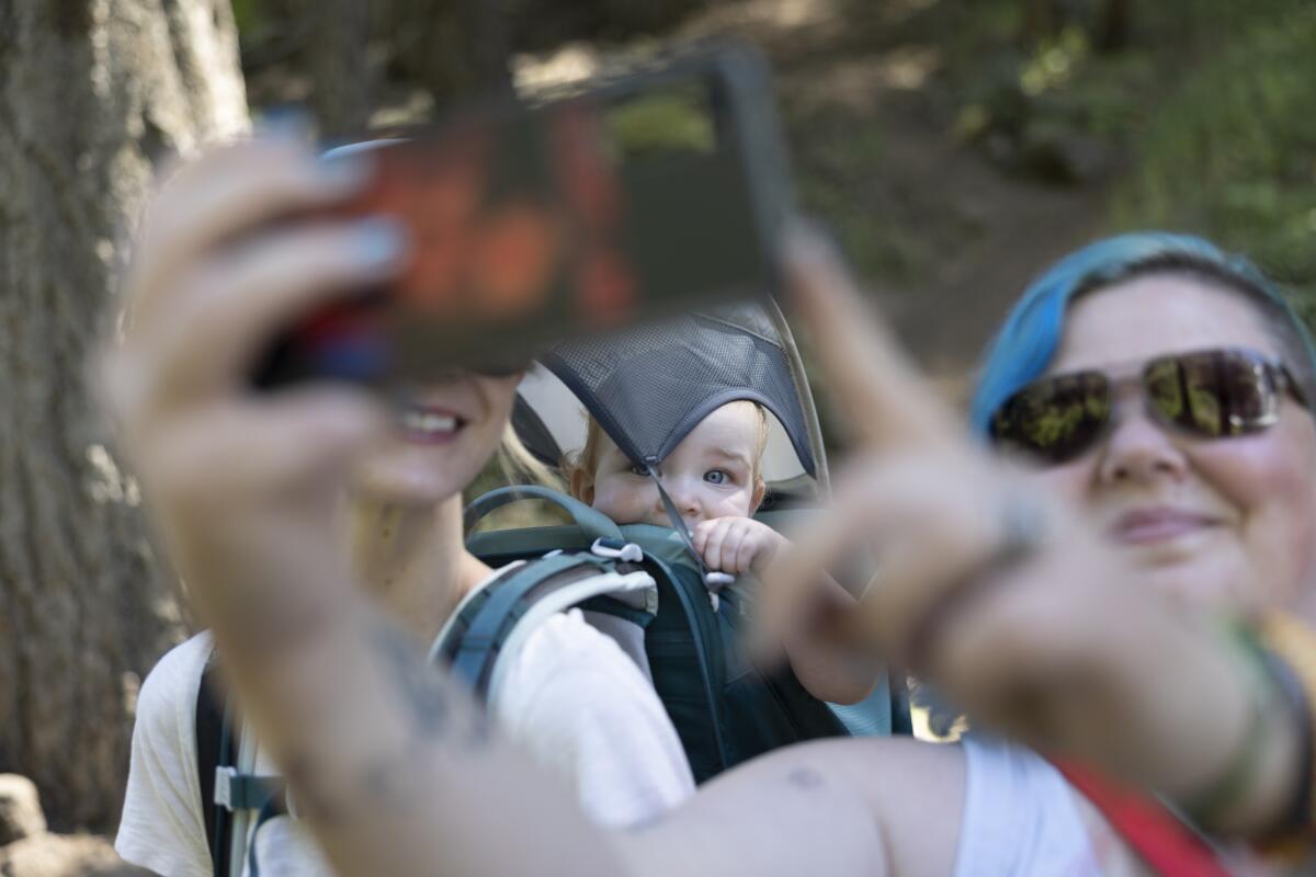 Visitors to Burney Falls pose for a selfie.