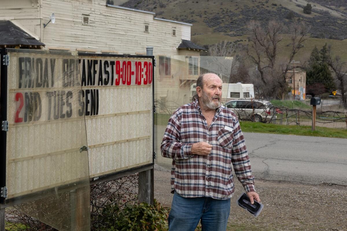 Volunteer Mickey Blazier sets letters for a sign outside the Hornbrook Community Center.