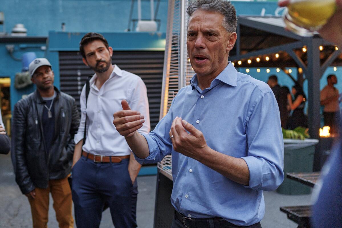 Mayoral candidate Adam Miller speaking with people