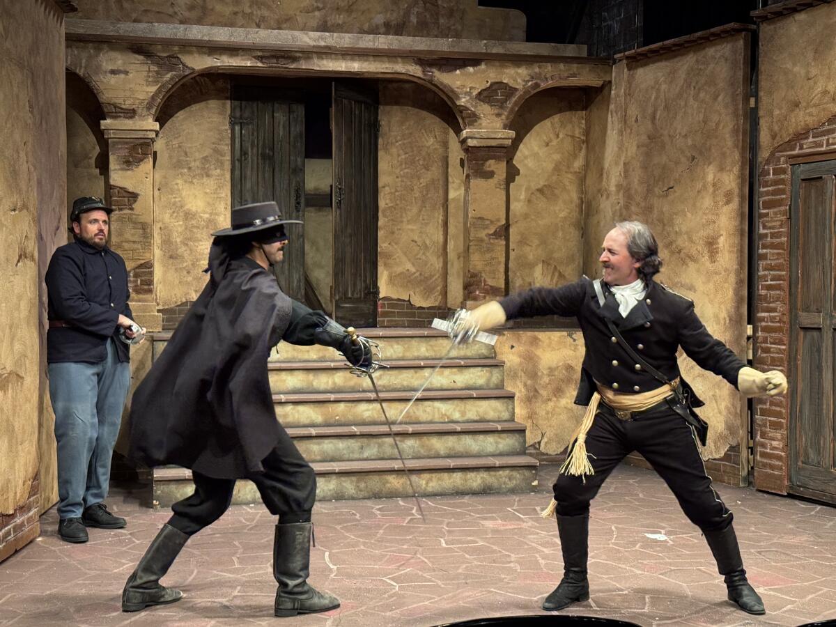 New Zorro Alejandro battles Captain Soleil as the Lieutenant stands frozen in the background in "The Return of Zorro."