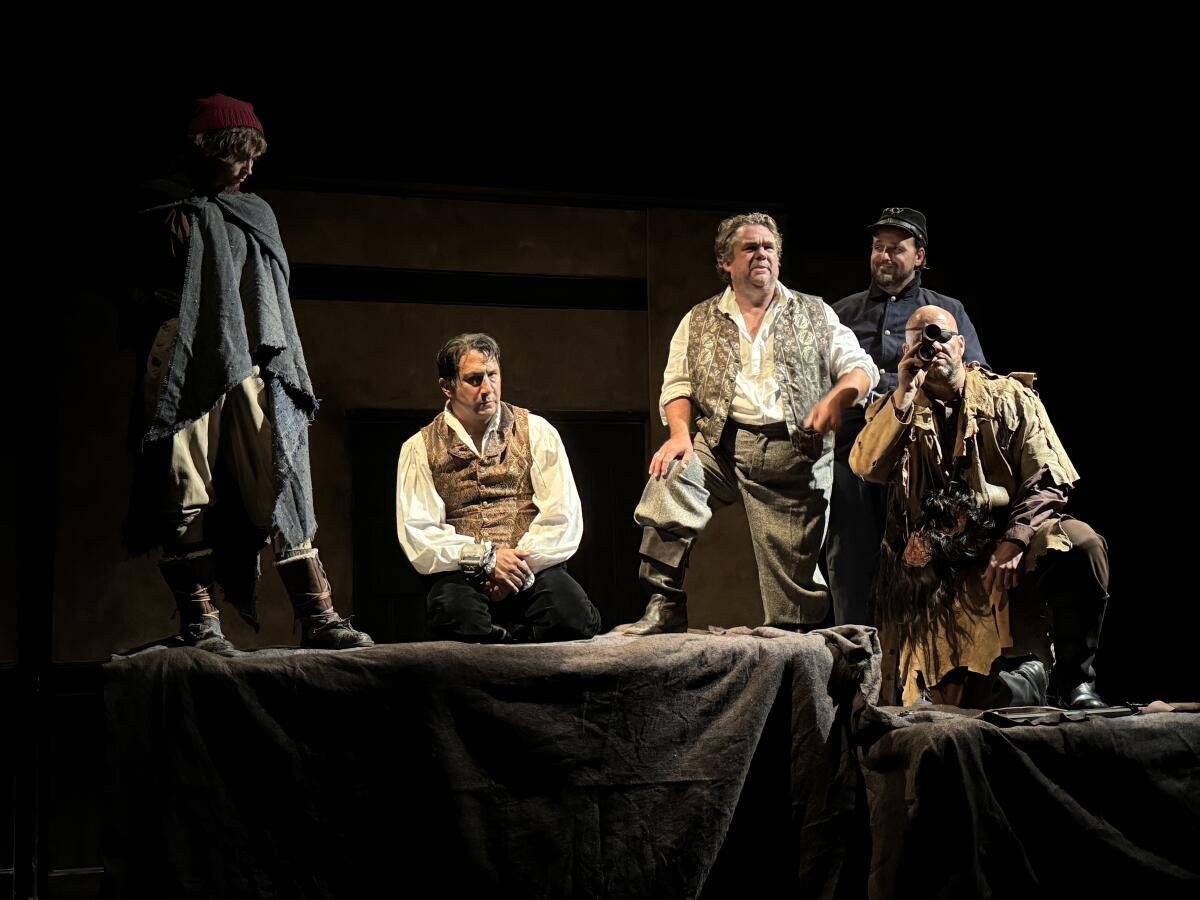 Diego Vega, aka Zorro, kneeling, has been captured by Yessica, Edgar Gordon, Lieutenant and Blanco.