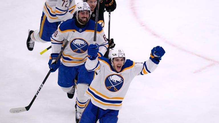 Buffalo Sabres center Peyton Krebs, front, celebrates after a goal...