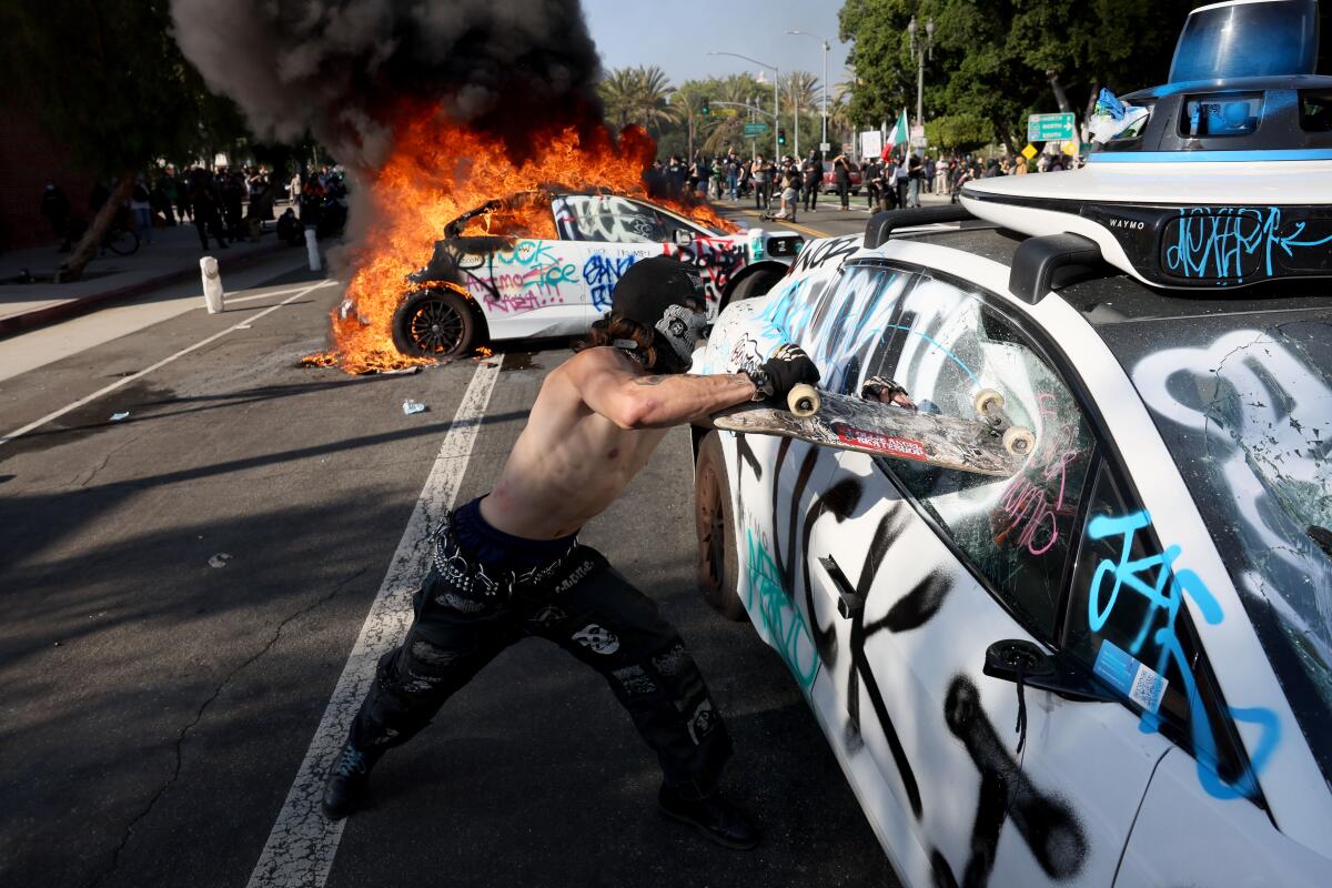 Two vehicles, one in flames 