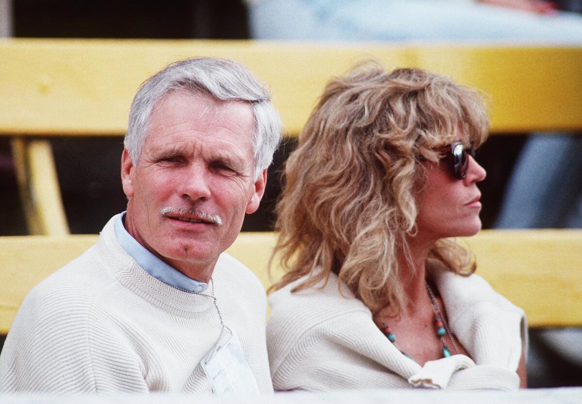 July 1990 image of Ted Turner with Jane Fonda.