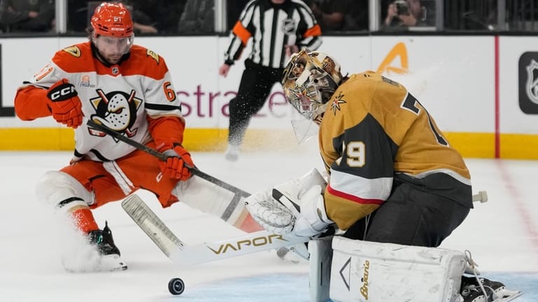 Vegas Golden Knights goaltender Carter Hart (79) stops a shot...